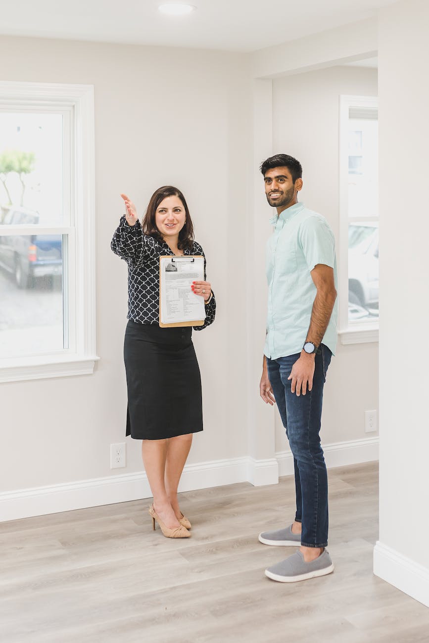 a real estate agent showing a house to a client